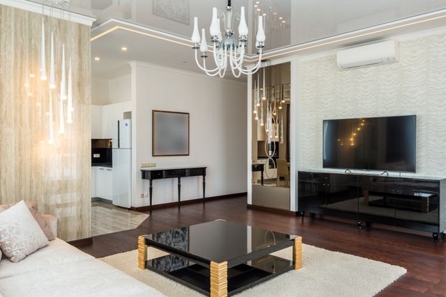 Elegant modern living room featuring a chic chandelier