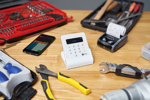 Payment terminal surrounded by tools